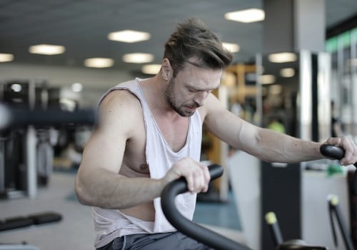 man working out on an elliptical