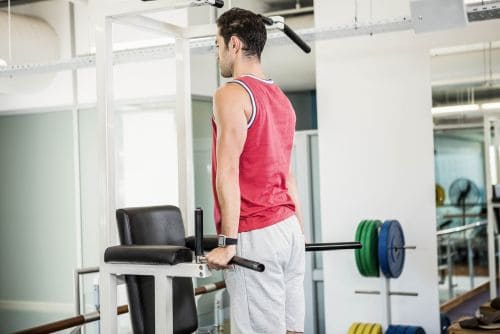 man using a Power Tower with Bench Machine