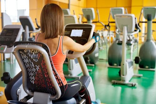 woman using Recumbent Elliptical