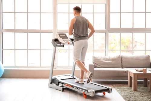 man jogging on a treadmill to protect his knees