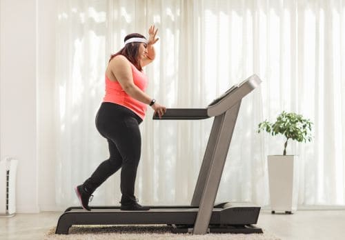 Lady learning how to lose weight on a treadmill