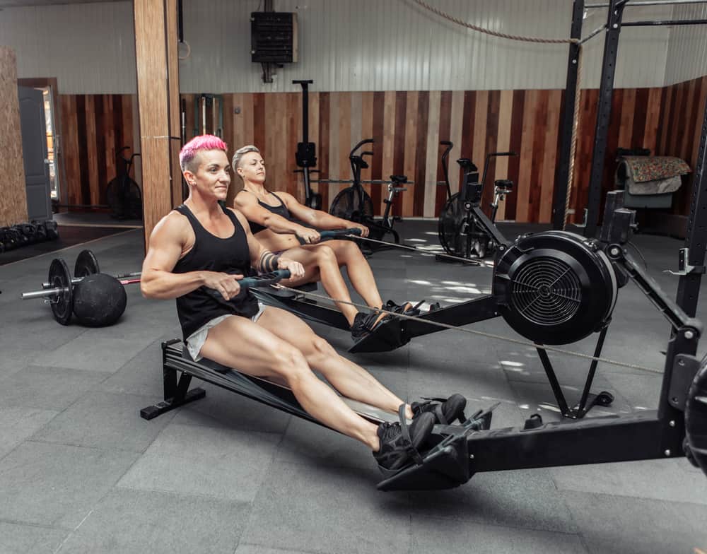 ladies showing how does a rowing machine work legs