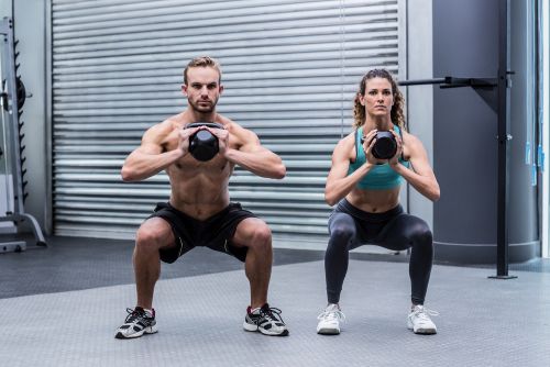 couple execising to make legs and thighs smaller