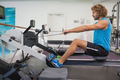 man learning at the gym will a rowing machine tone my legs