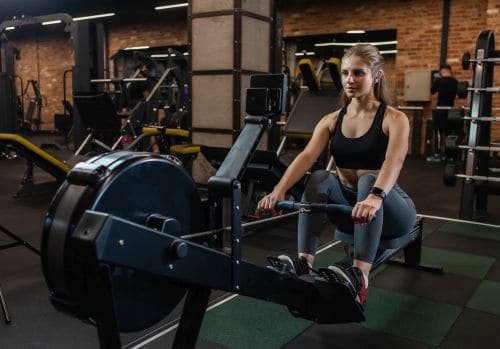 woman using a rower