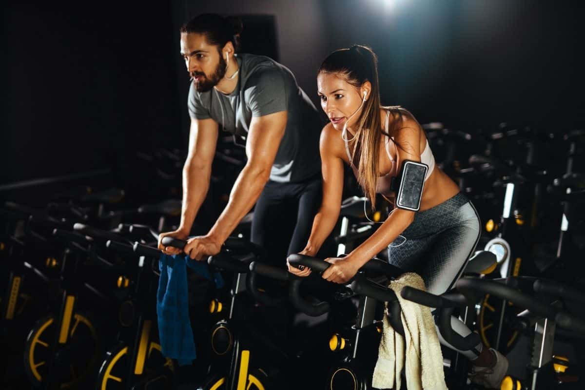 couple learning the benefits of an exercise bike vs walking