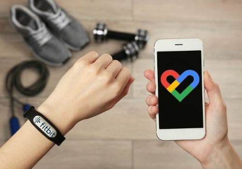 lady showing how to link google fit to fitbit